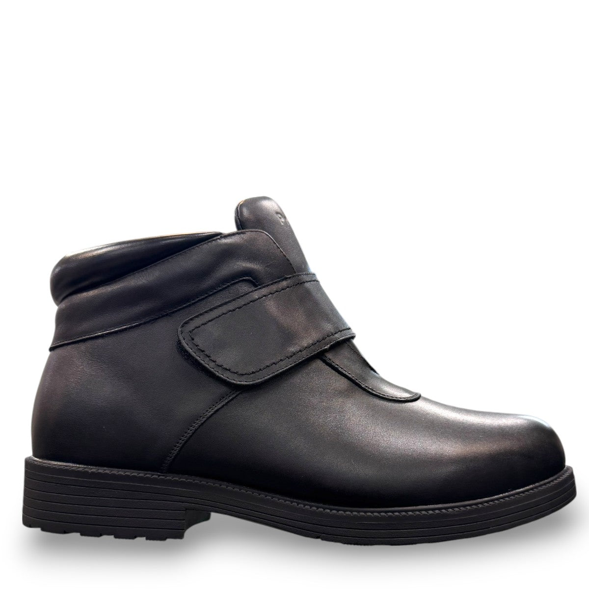 Propet Tyler black leather waterproof boot with hook and loop strap and rugged TPR outsole.
photo of the right side