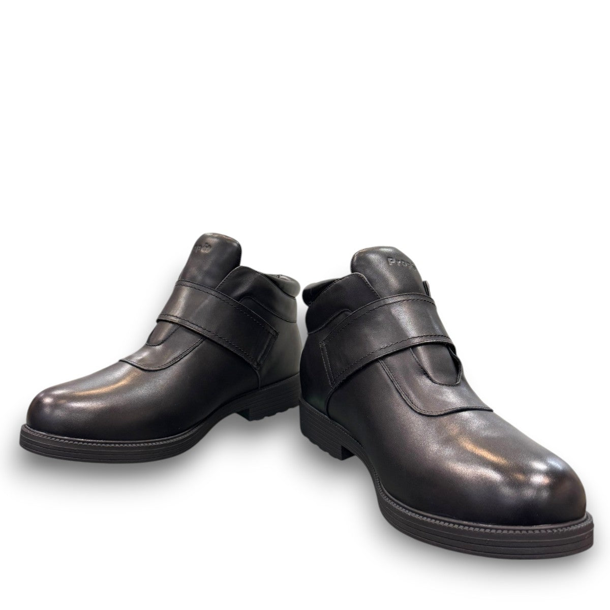 Propet Tyler black leather waterproof boot with hook and loop strap and rugged TPR outsole.
photo of the front side