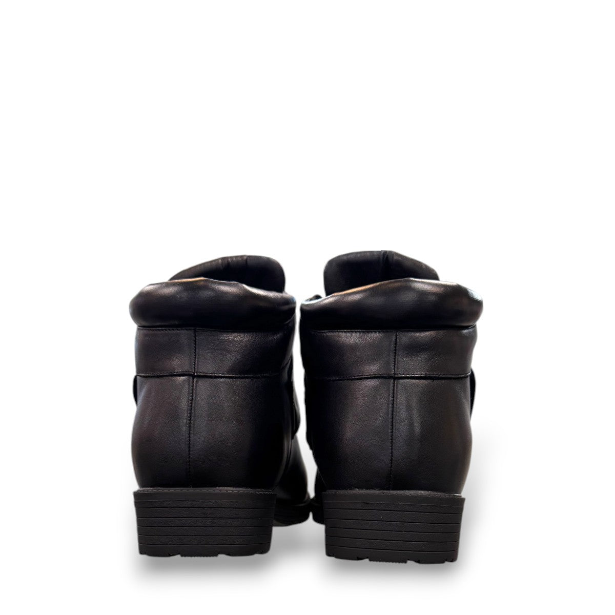 Propet Tyler black leather waterproof boot with hook and loop strap and rugged TPR outsole.
photo of the back side