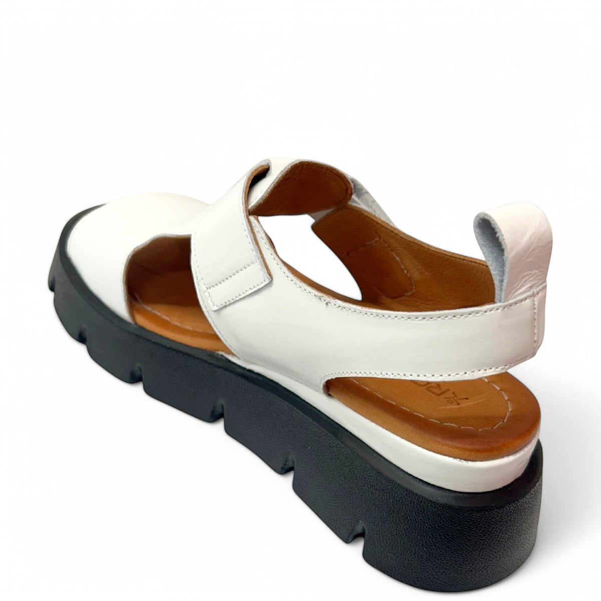 roamers white leather platform sandals with adjustable straps and a chunky black treaded sole.
photo of the back side