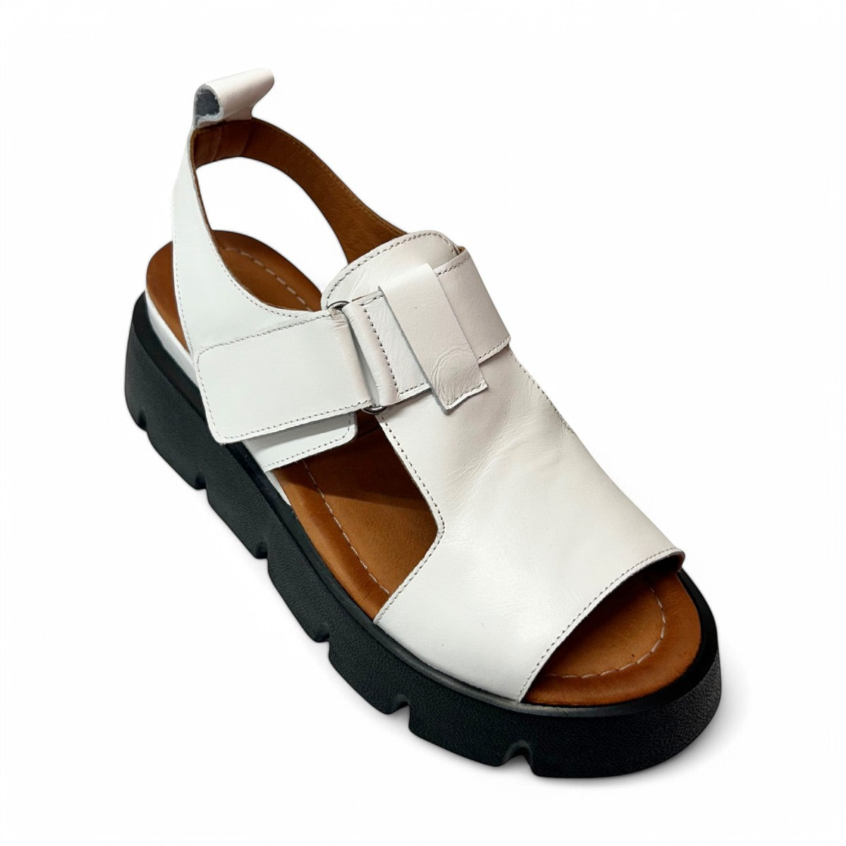 roamers white leather platform sandals with adjustable straps and a chunky black treaded sole.
photo of the front side