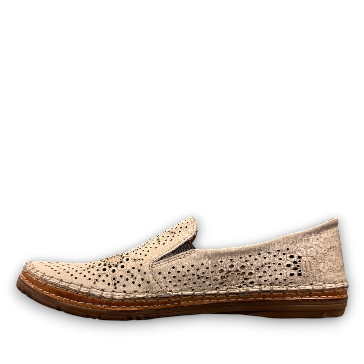 Roamers Atzi eggnog leather flat with cutout details and cushioned footbed.
photo of the left side