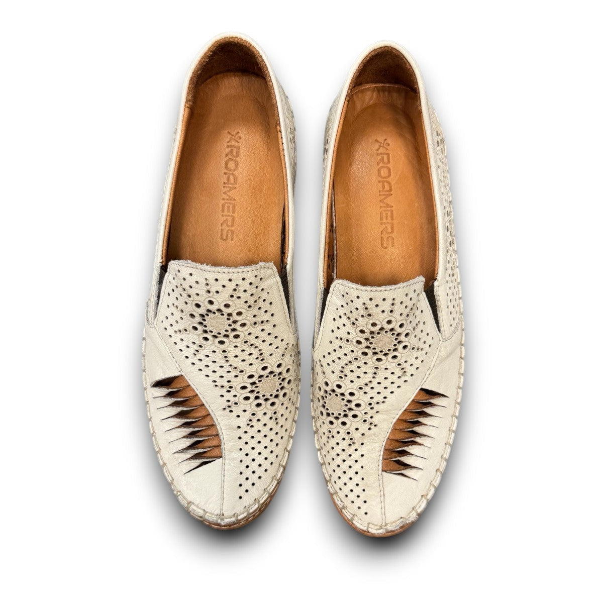 Roamers Atzi eggnog leather flat with cutout details and cushioned footbed.
photo of the top side