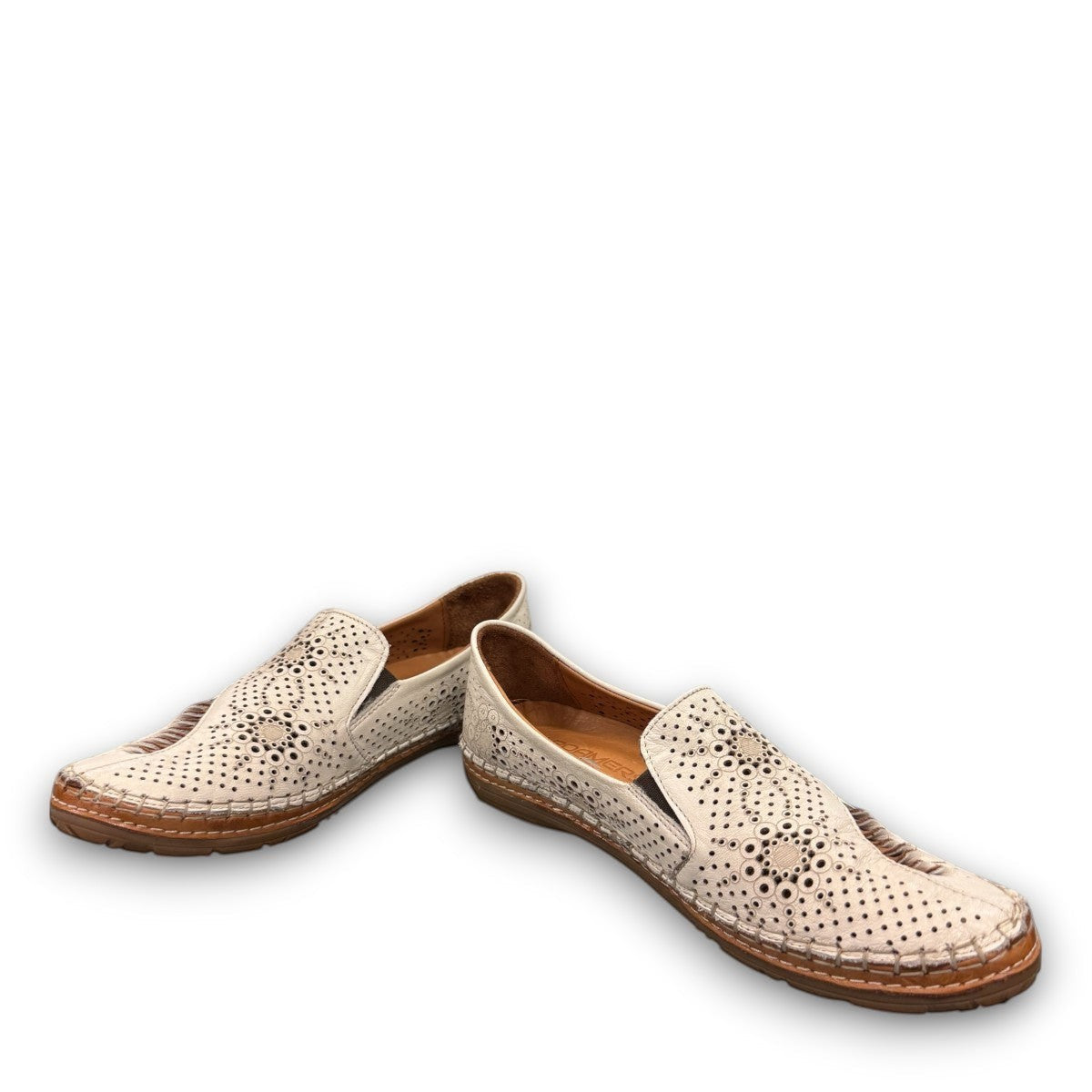 Roamers Atzi eggnog leather flat with cutout details and cushioned footbed.
photo of the front side