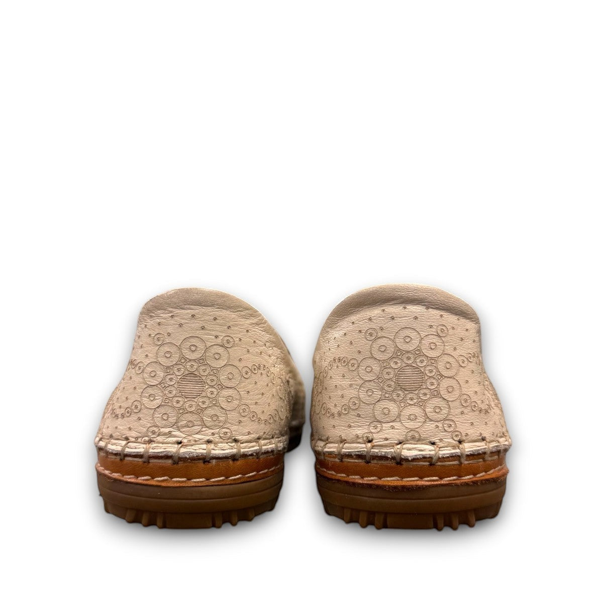 Roamers Atzi eggnog leather flat with cutout details and cushioned footbed.
photo of the back side
