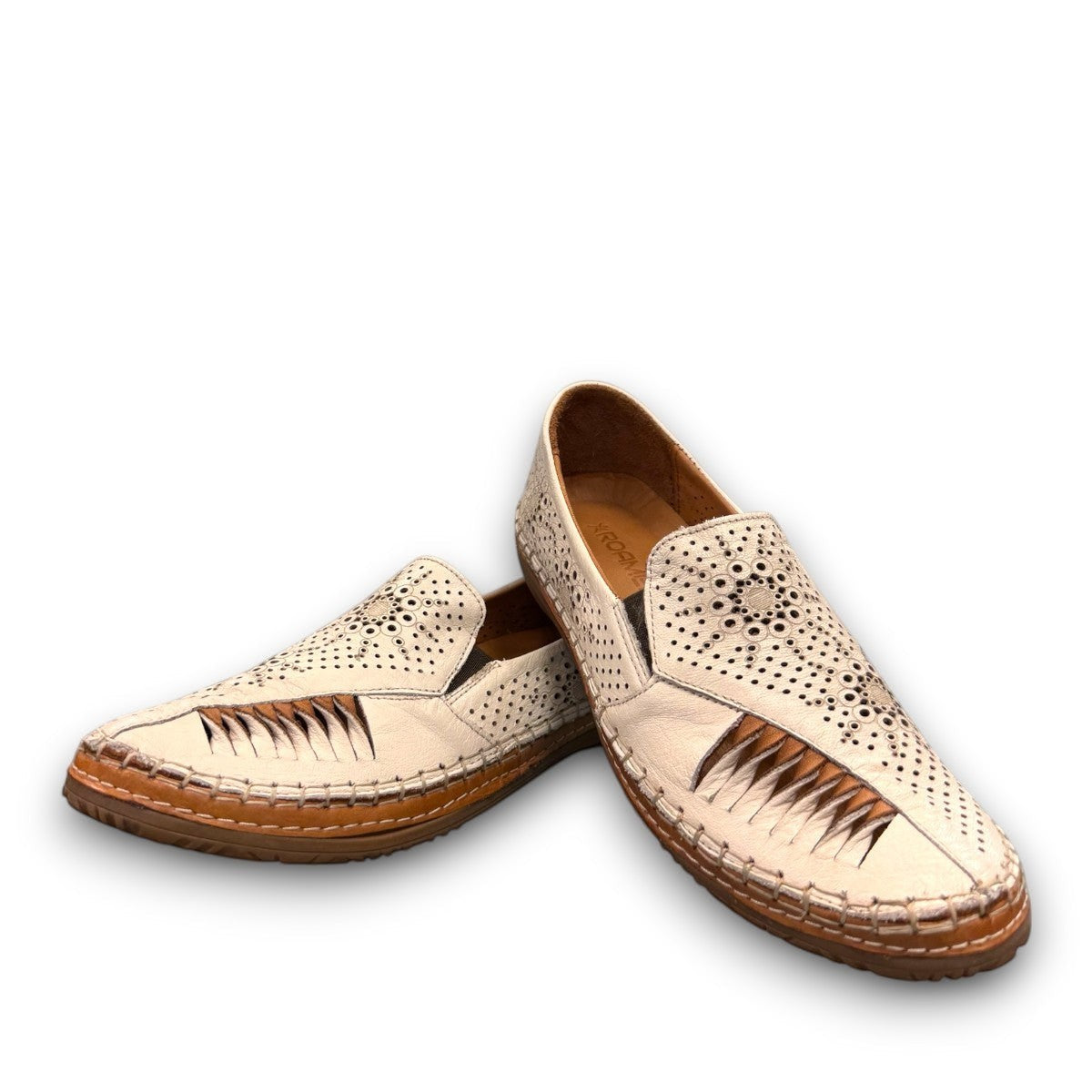 Roamers Atzi eggnog leather flat with cutout details and cushioned footbed.
photo of the front side