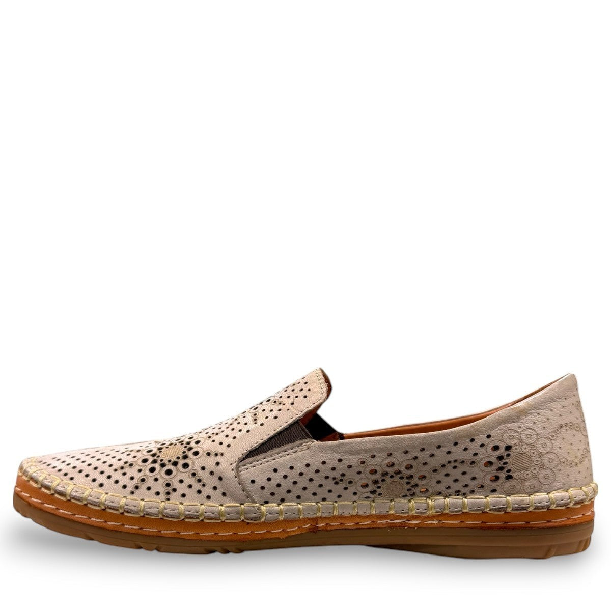 Roamers Atzi silver grey leather flat with intricate cutout details and a comfortable rubber sole.
photo of the left side