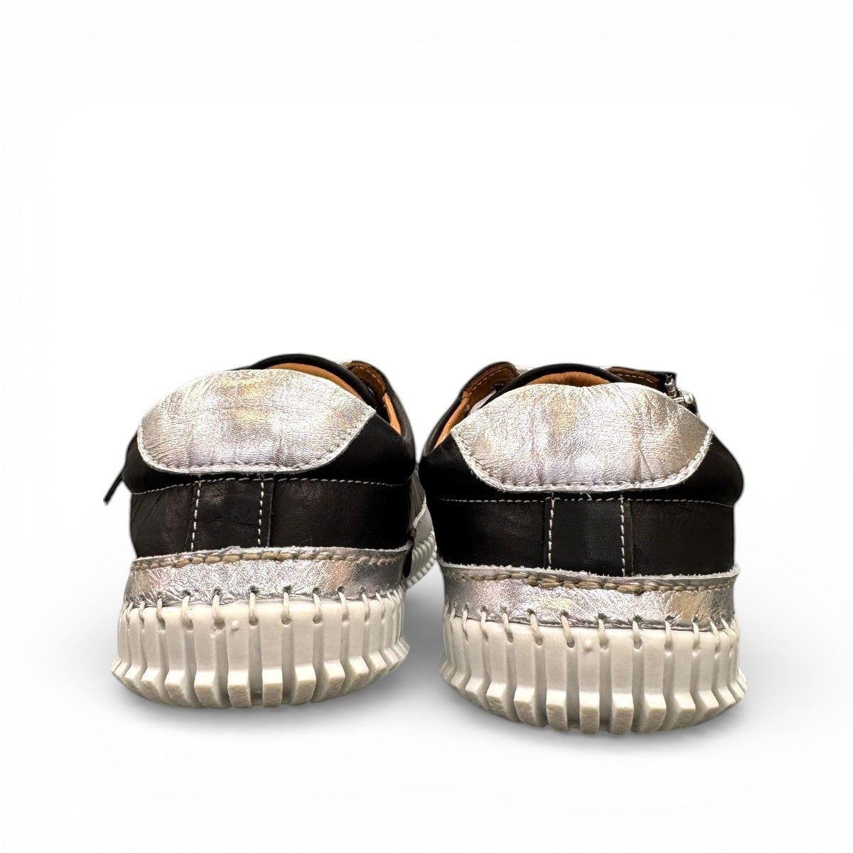 Roamers Audrey black leather sneaker with silver metallic trim, side zipper, and white rubber outsole.
photo of the back side