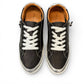 Roamers Audrey black leather sneaker with silver metallic trim, side zipper, and white rubber outsole.
photo of the top side
