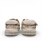 Roamers Audrey taupe leather sneaker with floral pattern, side zipper, and white rubber outsole.
photo of the back side