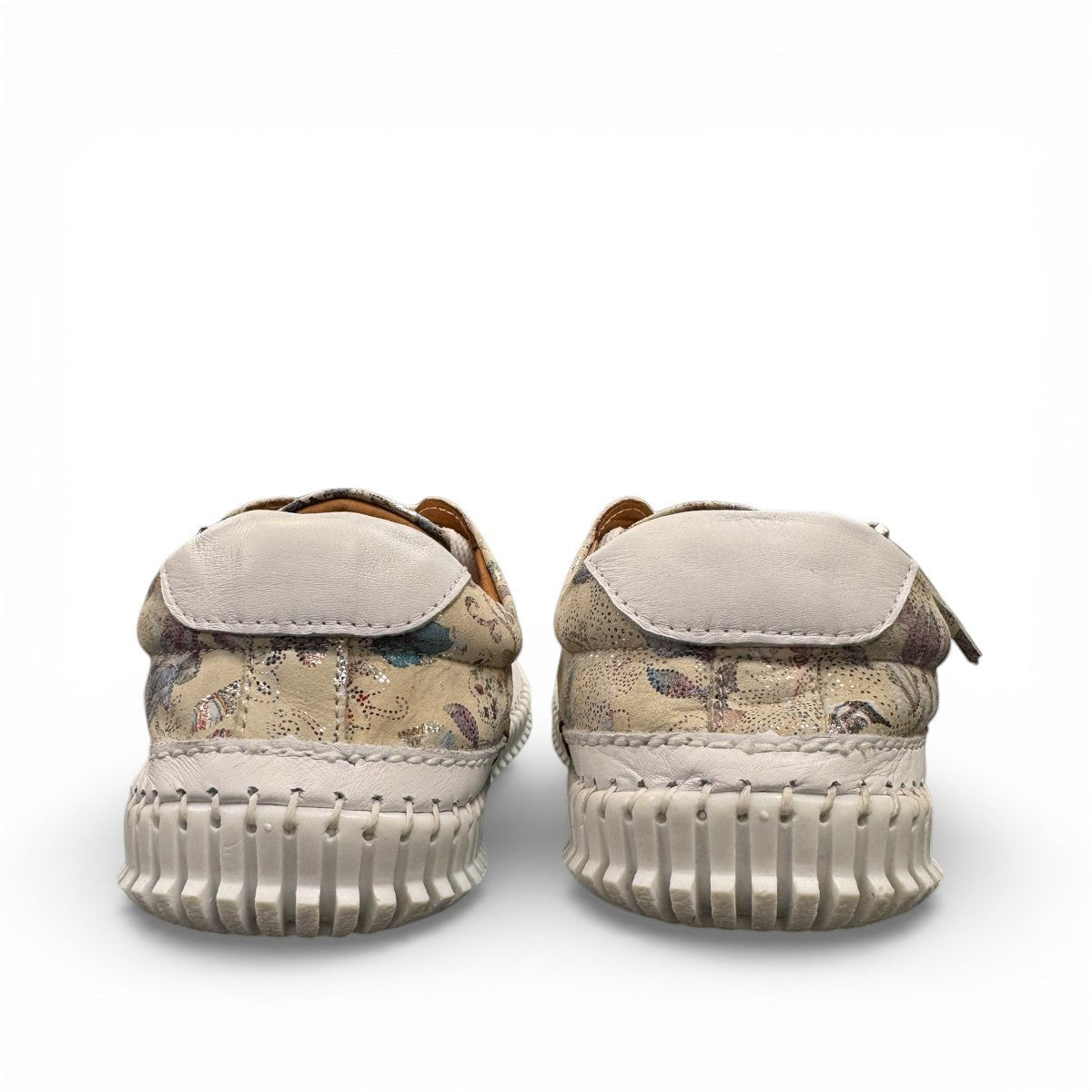 Roamers Audrey taupe leather sneaker with floral pattern, side zipper, and white rubber outsole.
photo of the back side