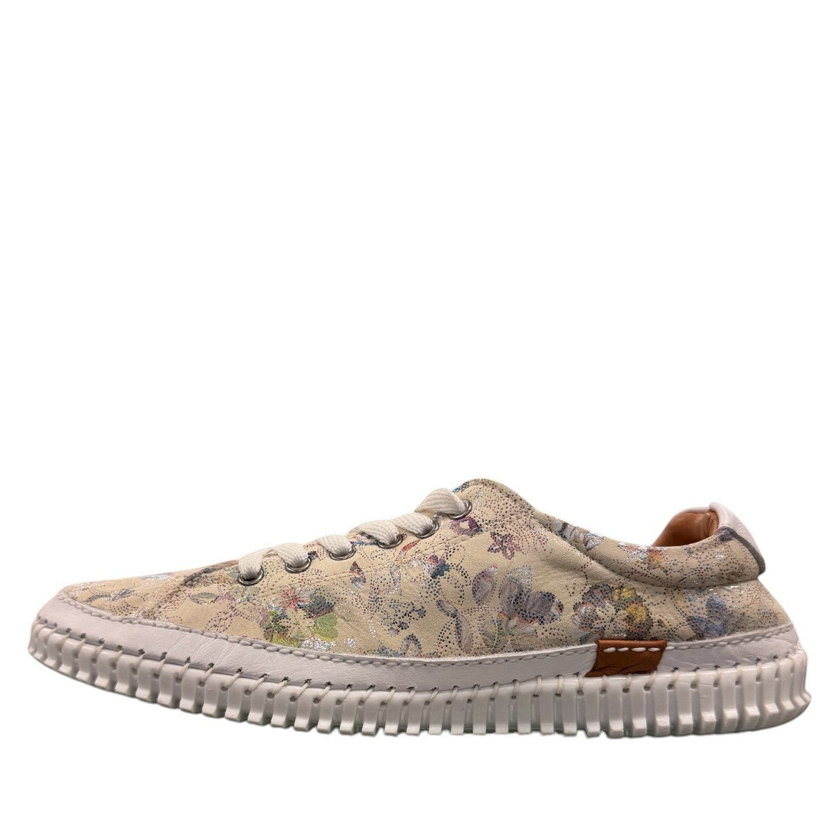Roamers Audrey taupe leather sneaker with floral pattern, side zipper, and white rubber outsole.
photo of the left side