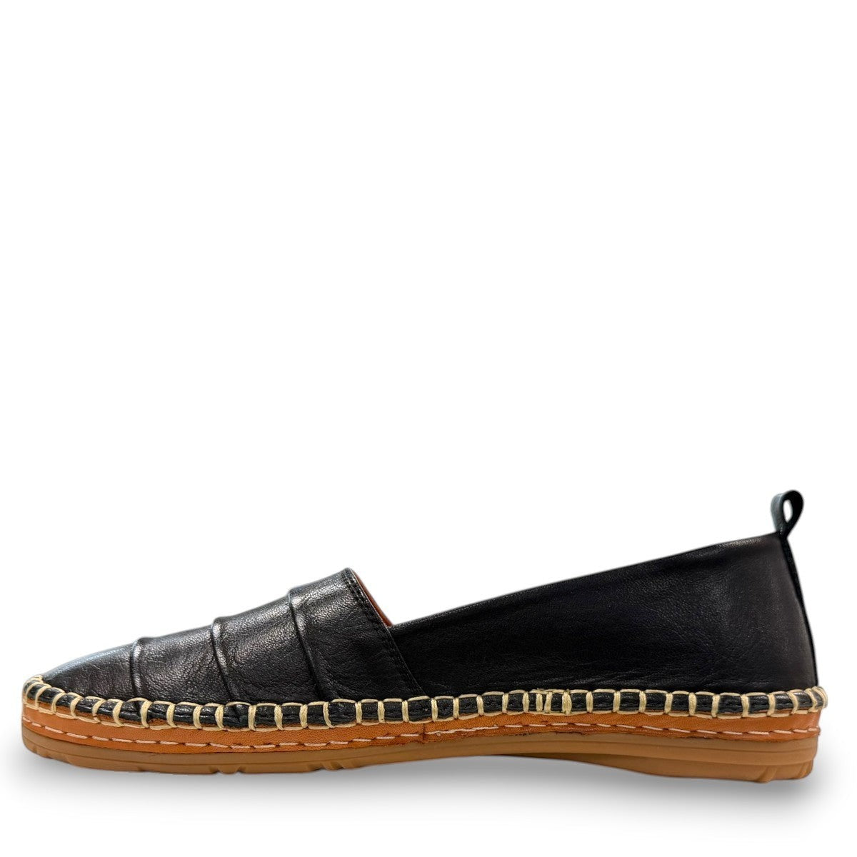 Roamers Avery black leather flat with decorative whipstitch detailing and a durable rubber sole.
photo of the left side