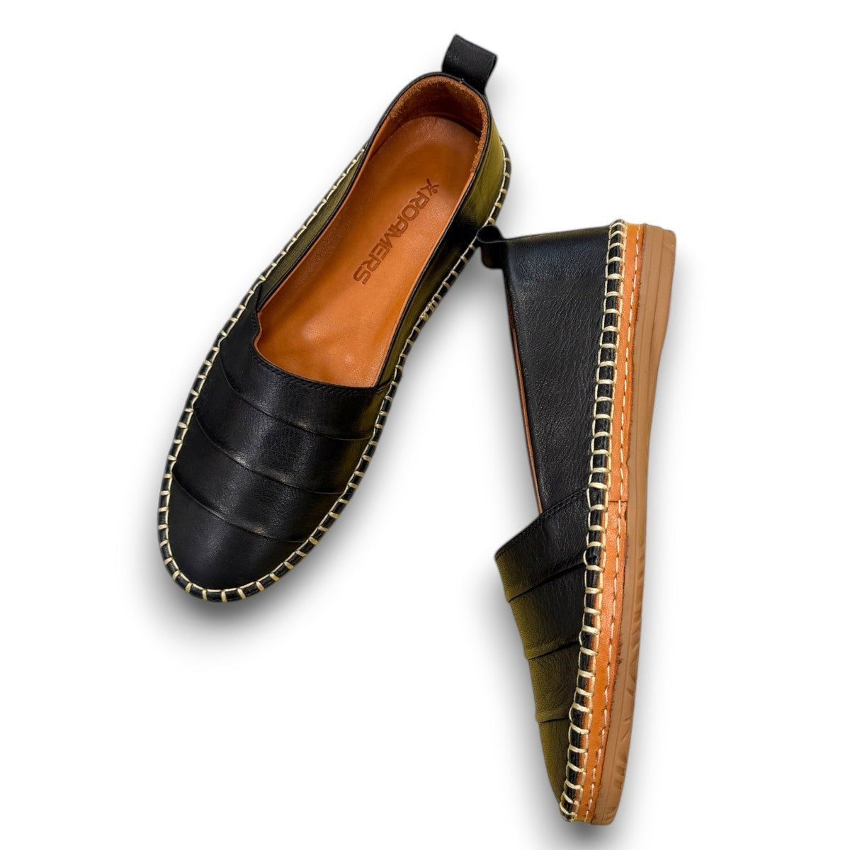 Roamers Avery black leather flat with decorative whipstitch detailing and a durable rubber sole.
photo of the top side