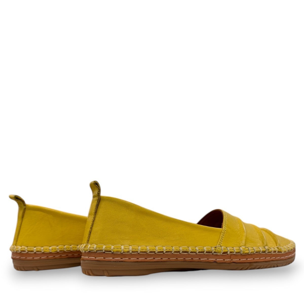 Roamers Avery yellow leather flat with cutout details and stitched rubber sole, side view.
photo of the back side