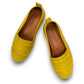 Roamers Avery yellow leather flat with cutout details and stitched rubber sole, side view.
photo of the top side