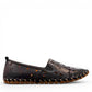 roamers black leather slip-on loafer with geometric laser cutouts, artisan stitching, and flexible rubber sole.
photo of the right side
