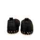 roamers black leather slip-on loafer with geometric laser cutouts, artisan stitching, and flexible rubber sole.
photo of the back side