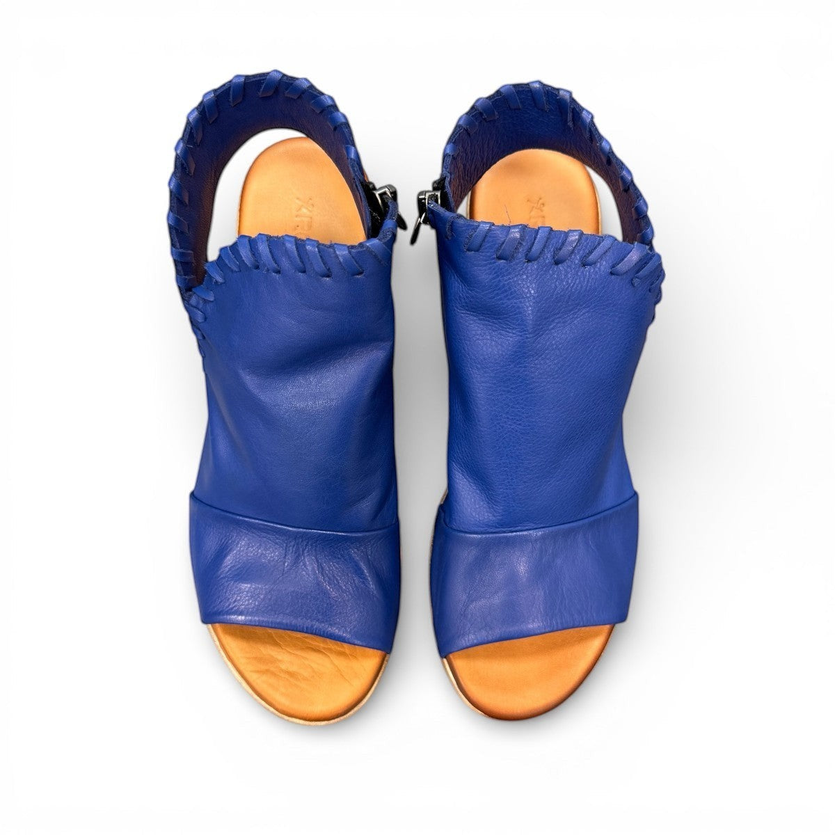 Roamers Eden sax blue leather wedge sandal with side zipper and decorative whipstitch detailing.
photo of the top side