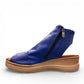 Roamers Eden sax blue leather wedge sandal with side zipper and decorative whipstitch detailing.
photo of the left side