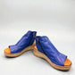 Roamers Eden sax blue leather wedge sandal with side zipper and decorative whipstitch detailing.
photo of the front side