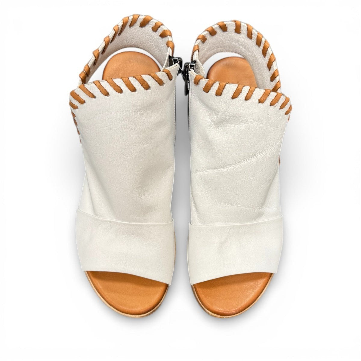 Roamers Eden white leather wedge sandal with brown lace-up detail and side zipper entry.
photo of the top side