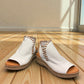 Roamers Eden white leather wedge sandal with brown lace-up detail and side zipper entry.
photo of the front side