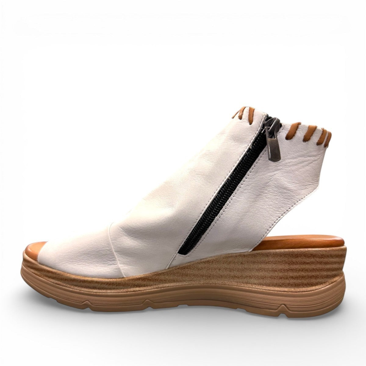 Roamers Eden white leather wedge sandal with brown lace-up detail and side zipper entry.
photo of the left side