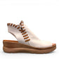 Roamers Eden white leather wedge sandal with brown lace-up detail and side zipper entry.
photo of the
