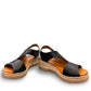 Roamers Ellsie black leather sling-back wedge sandal with elastic strap and textured platform sole.
photo of the front side