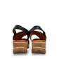 Roamers Ellsie black leather sling-back wedge sandal with elastic strap and textured platform sole.
photo of the back side
