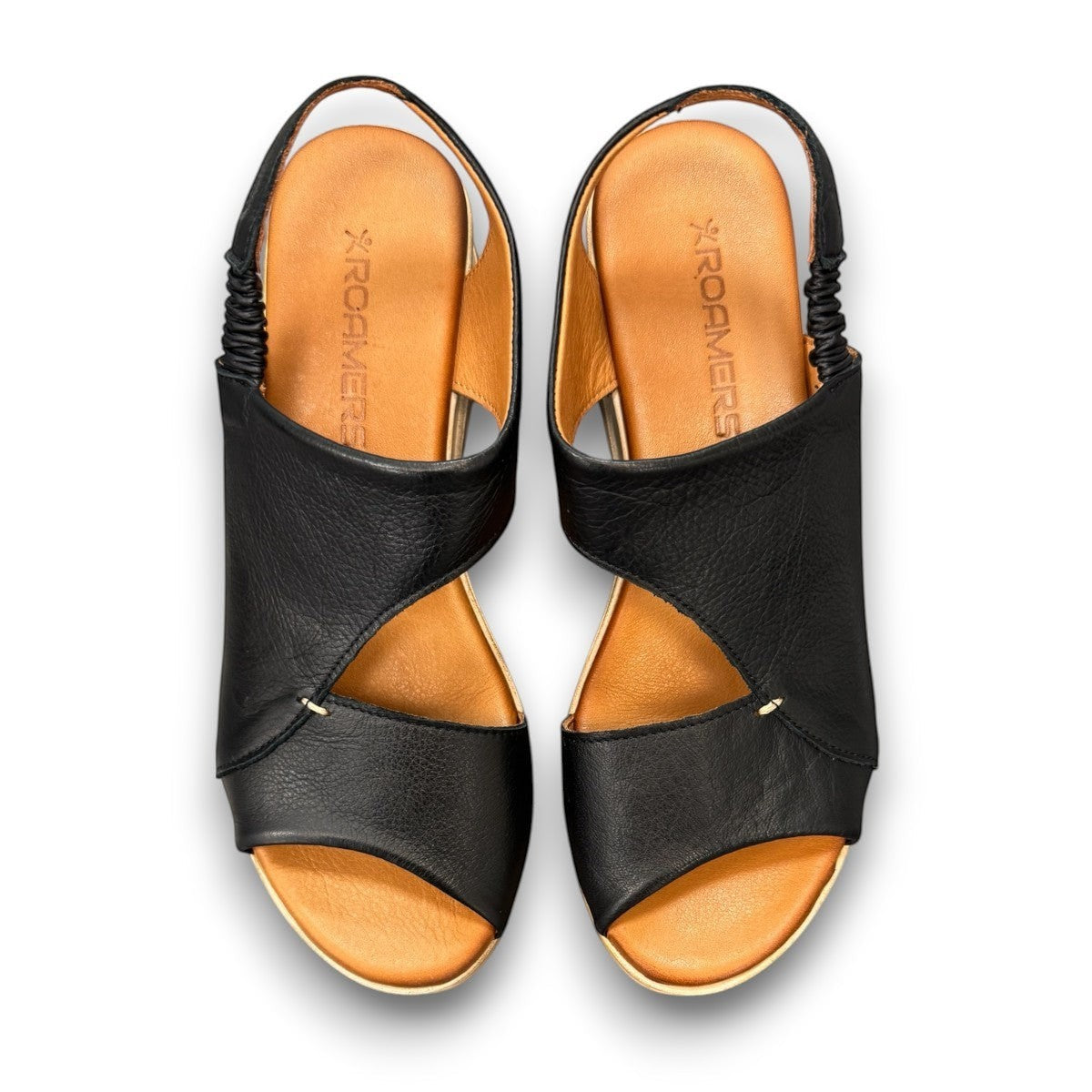 Roamers Ellsie black leather sling-back wedge sandal with elastic strap and textured platform sole.
photo of the top side