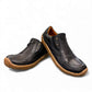 Roamers Enid black leather slip-on shoe with contrast stitching and a textured brown rubber sole.
photo of the front side