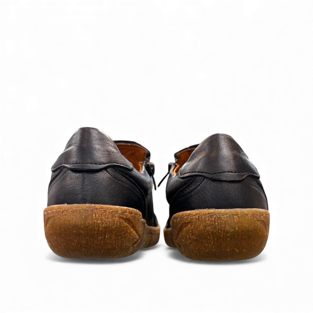 Roamers Enid black leather slip-on shoe with contrast stitching and a textured brown rubber sole.
photo of the back side