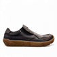 Roamers Enid black leather slip-on shoe with contrast stitching and a textured brown rubber sole.
photo of the right side