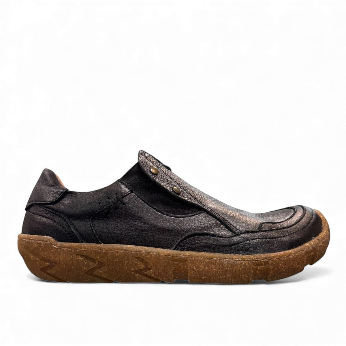 Roamers Enid black leather slip-on shoe with contrast stitching and a textured brown rubber sole.
photo of the right side