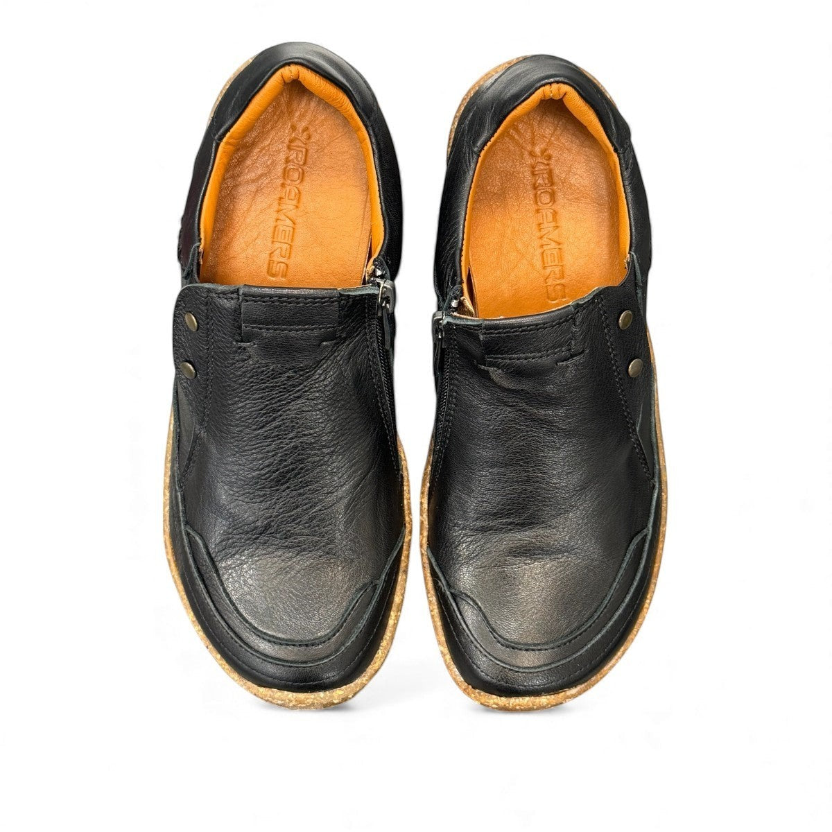 Roamers Enid black leather slip-on shoe with contrast stitching and a textured brown rubber sole.
photo of the top side