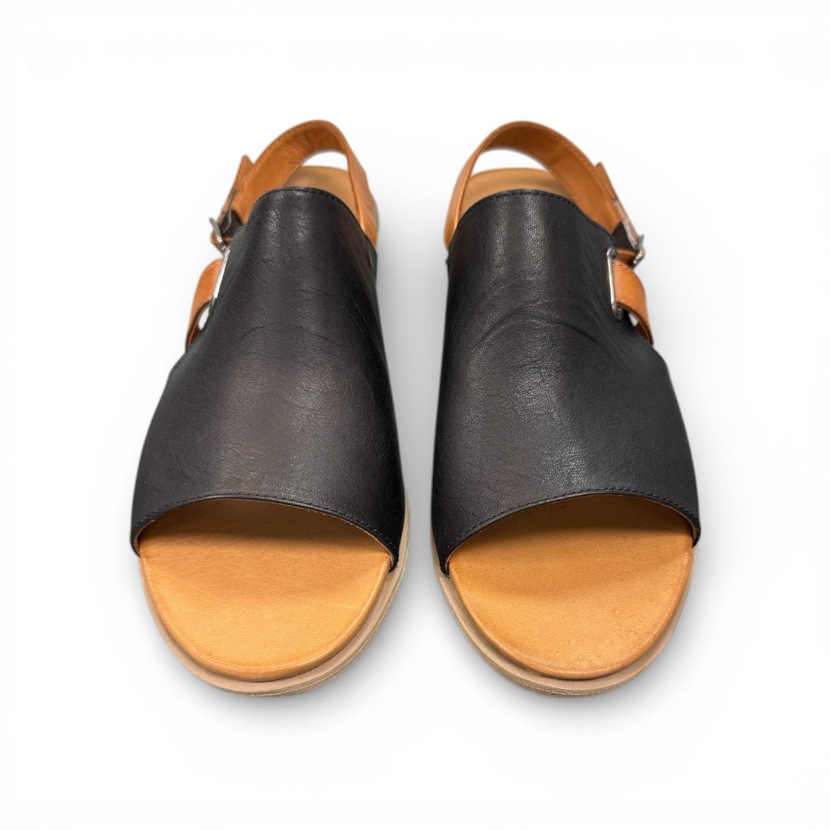Roamers Jude low heel sandal in black and tan leather with a side buckle and open toe design.
photo of the top side