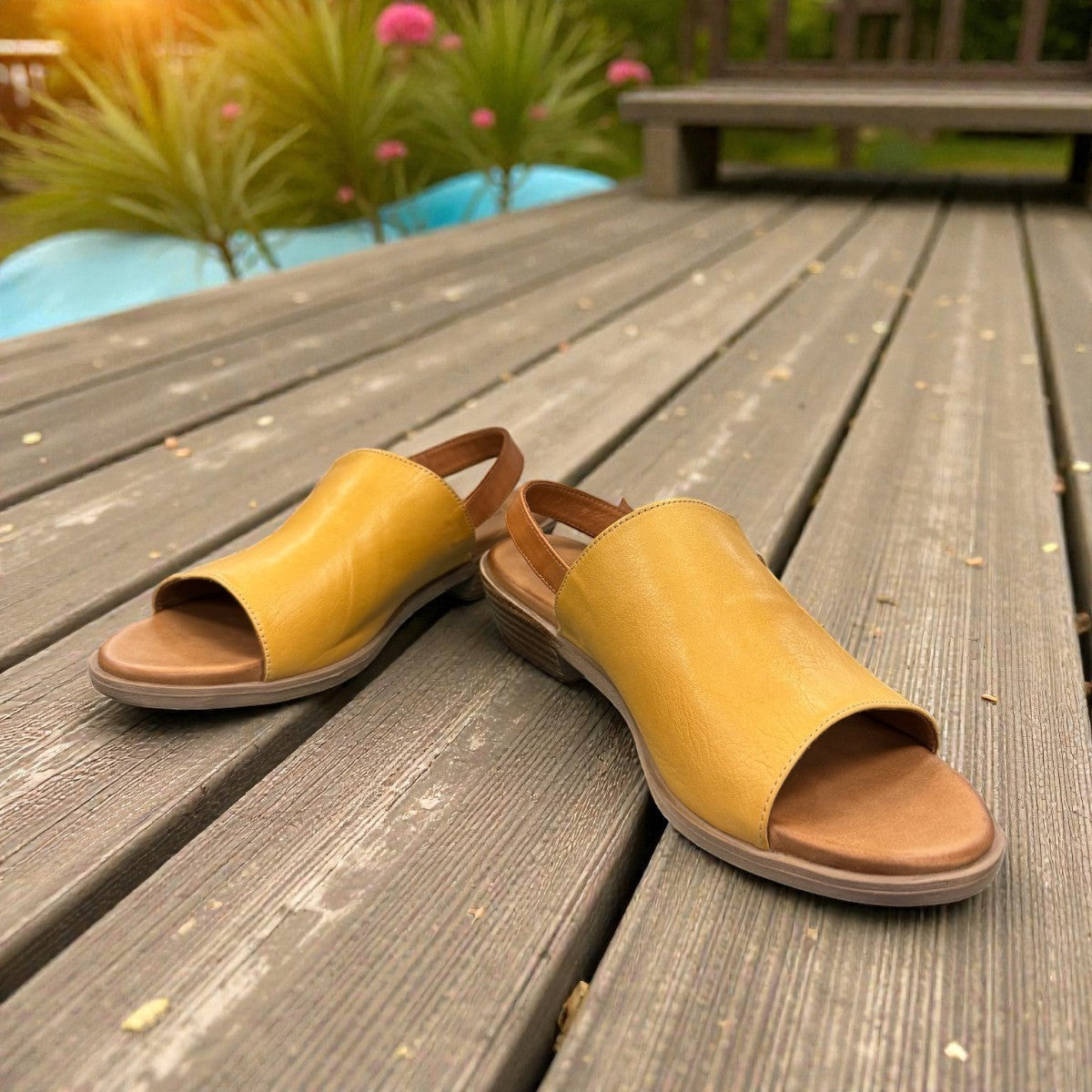Roamers Jude low heel sandal in yellow and brown leather with a side buckle strap.
photo of the front side
