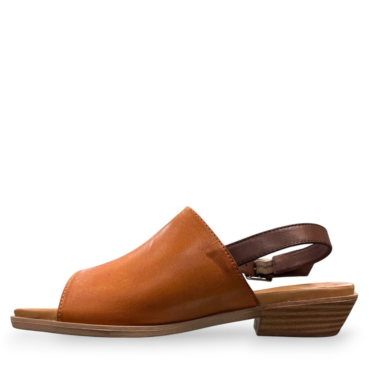 Roamers Jude tan and brown leather low heel sandal with side buckle strap.
photo of the left side