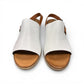 roamers Jude low heel sandal in white coconut leather with a brown side buckle strap and stacked heel.
photo of the top side