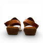 roamers Jude low heel sandal in white coconut leather with a brown side buckle strap and stacked heel.
photo of the back side