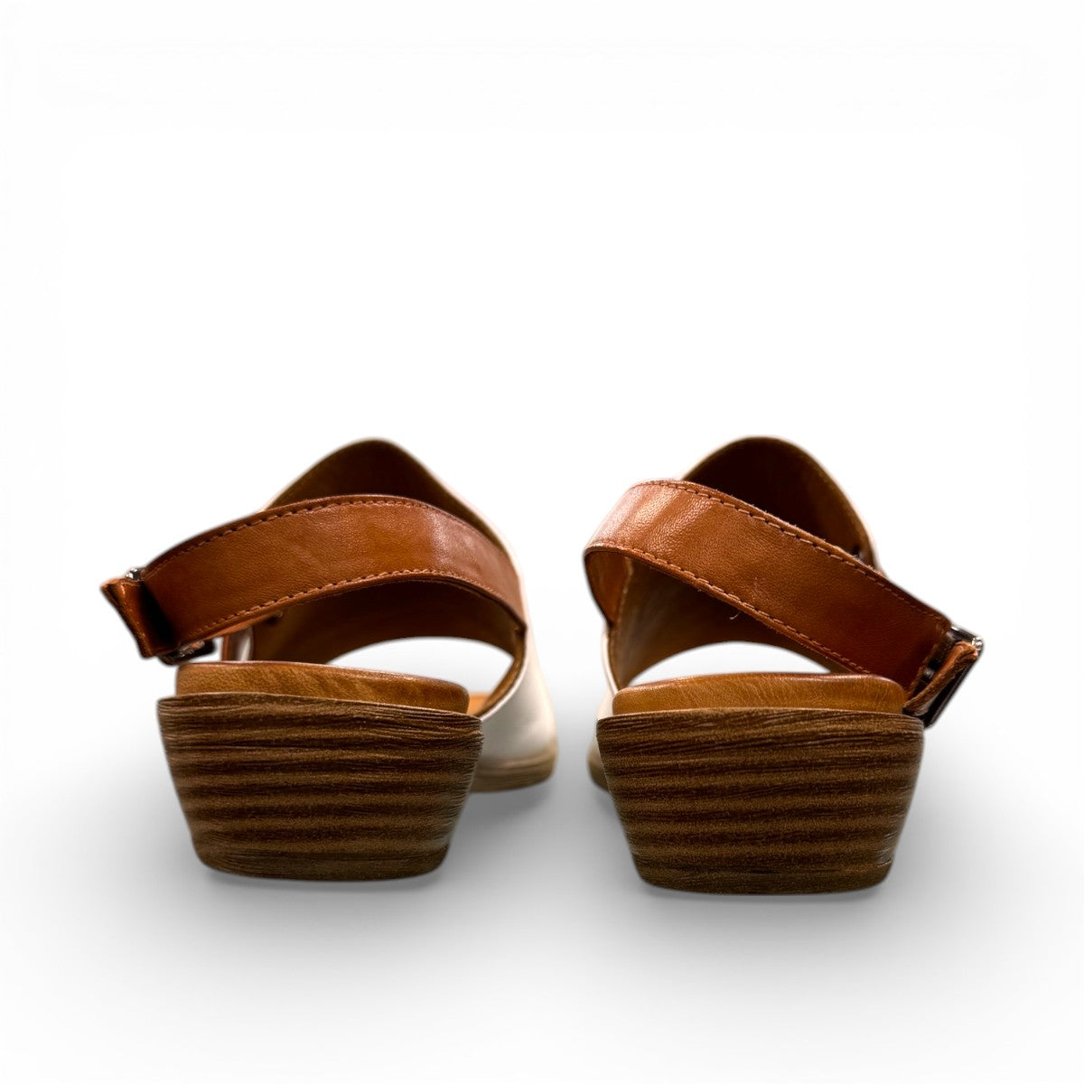 roamers Jude low heel sandal in white coconut leather with a brown side buckle strap and stacked heel.
photo of the back side
