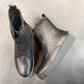 Roamers Kennedy black leather ankle boot with a thick ribbed rubber platform sole and side zipper.