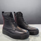 Roamers Kennedy black leather ankle boot with a thick ribbed rubber platform sole and side zipper.