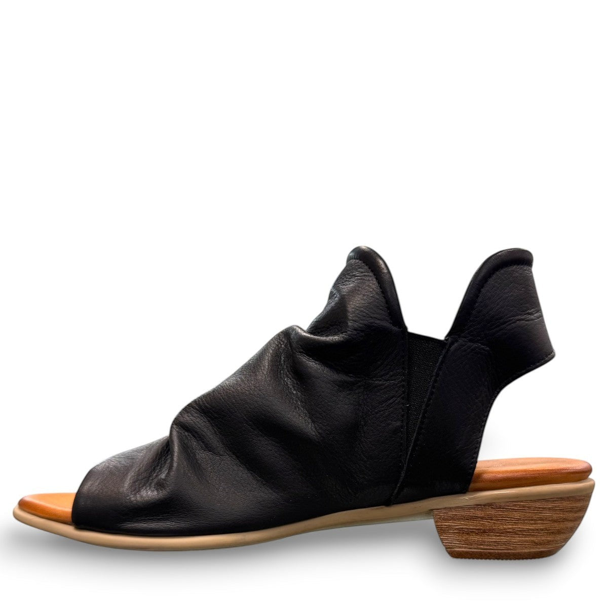 Roamers Maddison black leather open-toe sandal with a low wooden heel and comfortable footbed.
photo of the left side