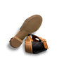 Roamers Mae black and tan leather sandals with side buckle and low block heel.
photo of the bottom side