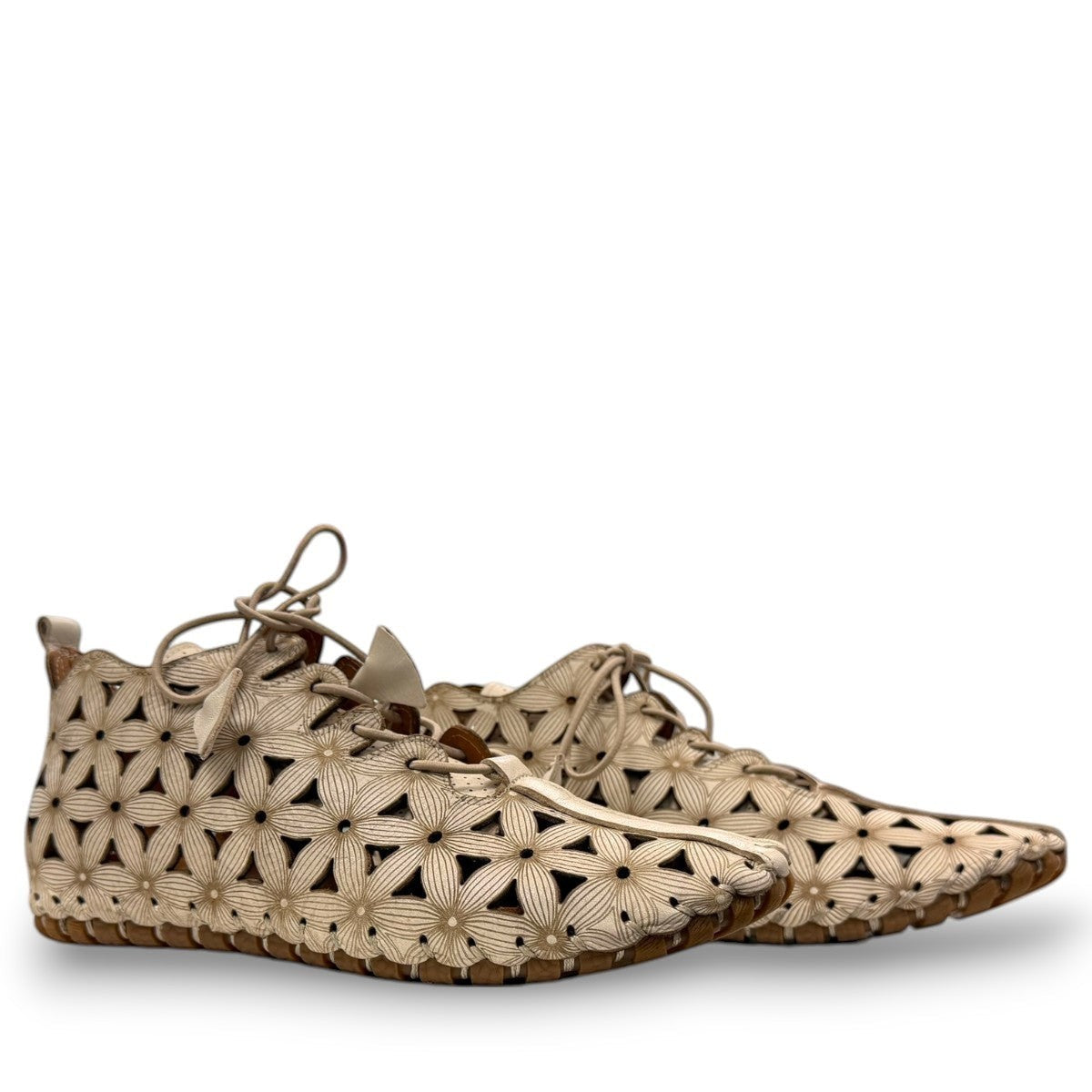 Roamers Venus mink leather ankle boots featuring a decorative floral cutout pattern and elastic lacing.
photo of the side