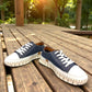 ROAMERS PARIS leather sneakers in navy and white with a unique chunky rubber sawtooth outsole.
photo of the front side