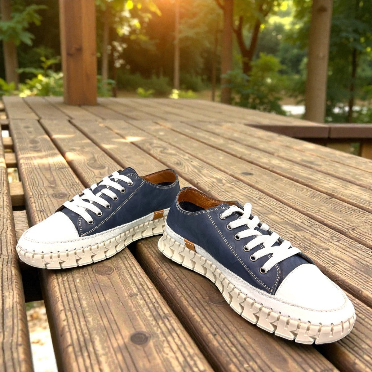 ROAMERS PARIS leather sneakers in navy and white with a unique chunky rubber sawtooth outsole.
photo of the front side